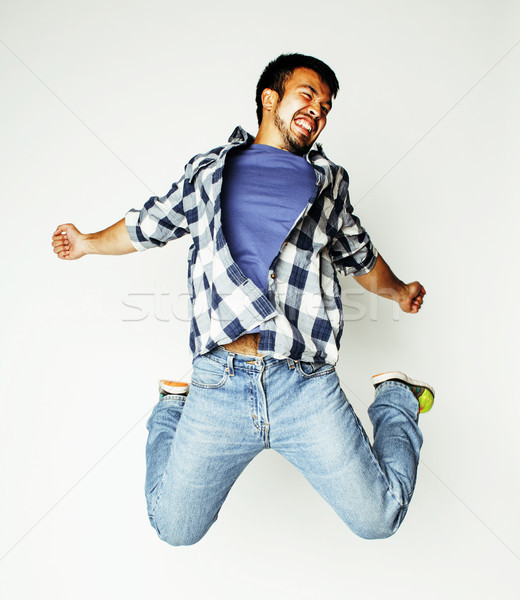 young pretty asian man jumping cheerful against white background Stock photo © iordani