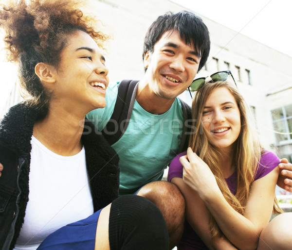 cute group teenages at the building of university Stock photo © iordani