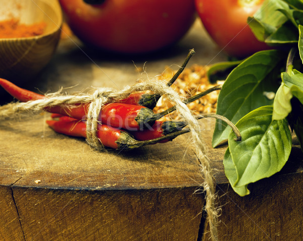 vegetables on wooden kitchen with spicies, tomato, chilli, green Stock photo © iordani
