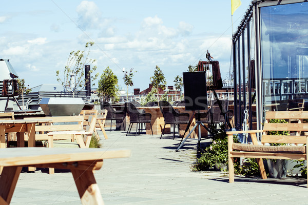 post card view. empty summer roof top cafe, lot of tables Stock photo © iordani