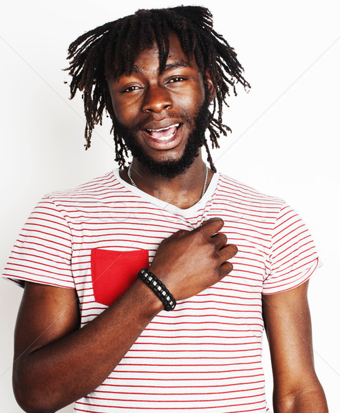 young handsome african american boy smiling emotional isolated on white background, in motion gestur Stock photo © iordani