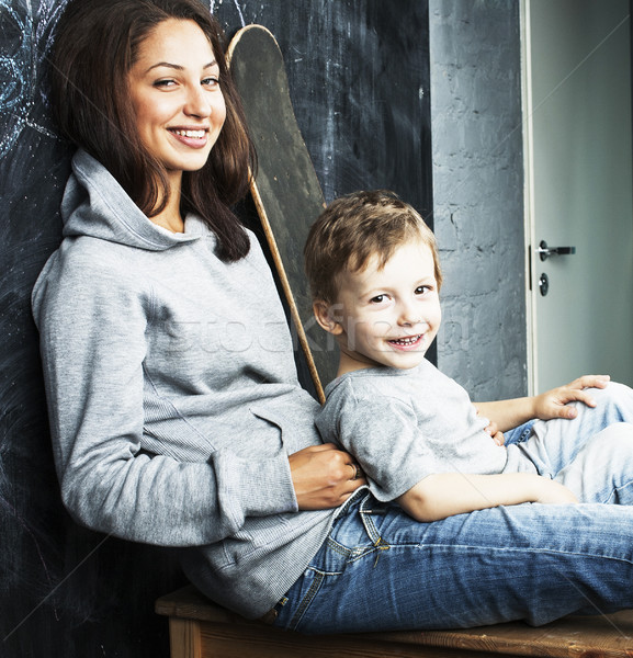 little cute boy with young teacher in classroom studying at blac Stock photo © iordani