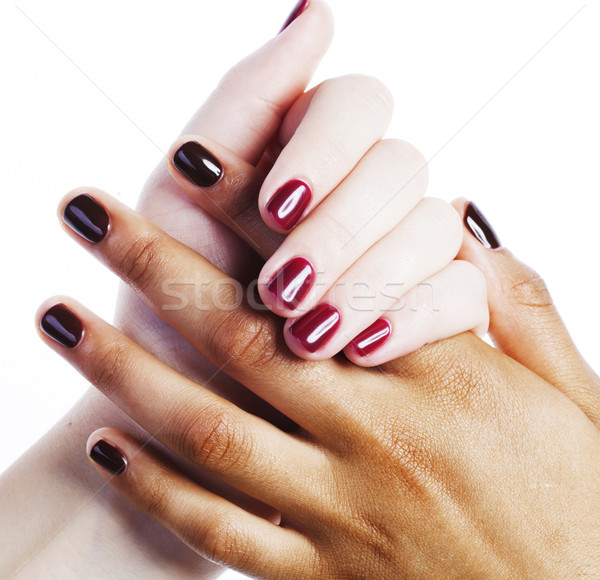 two different nathion manicured hands on white isolated, african Stock photo © iordani