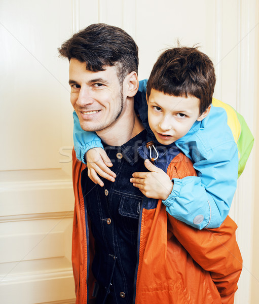 young handsome father with his son fooling around at home, lifes Stock photo © iordani