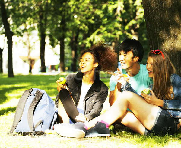 cute group of teenages at the building of university with books huggings, diversity nations Stock photo © iordani
