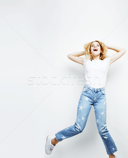 young pretty teenage girl jumping cheerful isolated on white background, lifestyle people concept  Stock photo © iordani