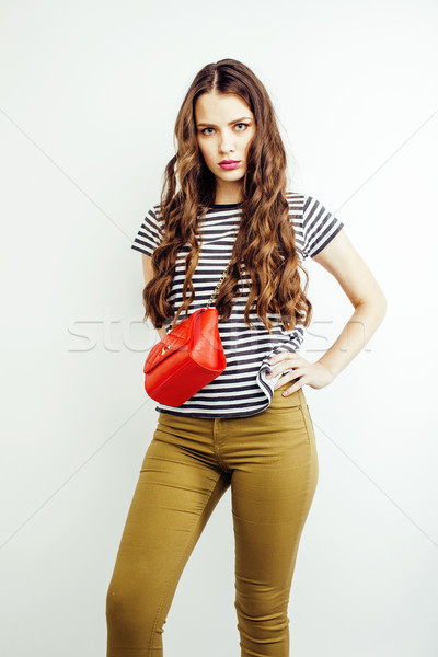 young pretty long hair woman happy smiling isolated on white background, wearing cute tiny handbag,  Stock photo © iordani