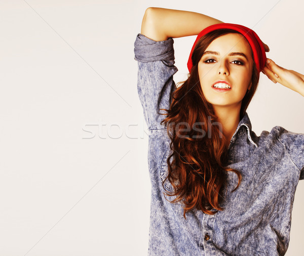 young cheerful brunette teenage girl on white background Stock photo © iordani