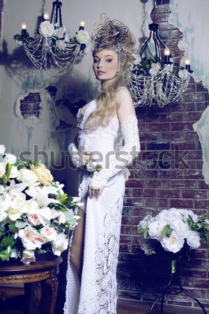Stock photo: beauty young bride alone in luxury vintage interior with a lot of flowers close up
