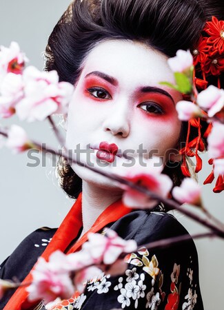 pretty brunette woman with rose jewelry, black and red, bright m Stock photo © iordani