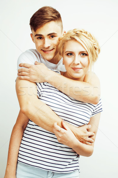 young pretty teenage couple, hipster guy with his girlfriend happy smiling and hugging isolated on w Stock photo © iordani