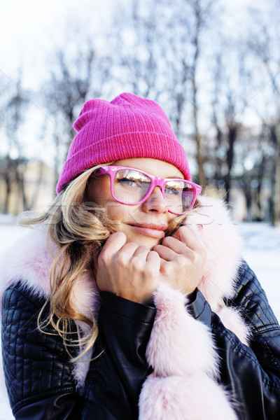 young pretty teenage hipster girl outdoor in winter snow park having fun drinking coffee, warming up Stock photo © iordani