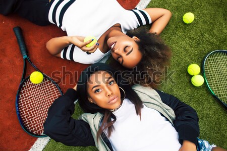 young pretty girlfriends hanging on tennis court, fashion stylis Stock photo © iordani