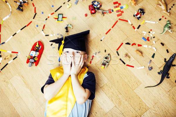 little cute preschooler boy among toys lego at home in graduate  Stock photo © iordani