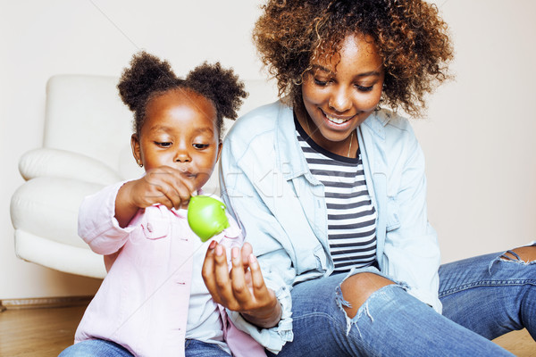 adorable sweet young afro-american mother with cute little daugh Stock photo © iordani