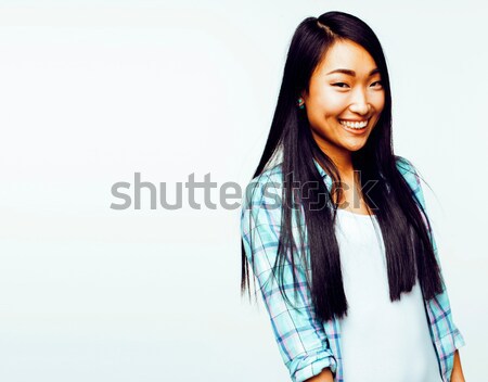 Stock photo: young pretty asian woman posing cheerful emotional isolated on w