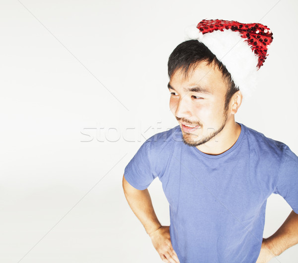 funy exotical asian Santa claus in new years red hat smiling Stock photo © iordani