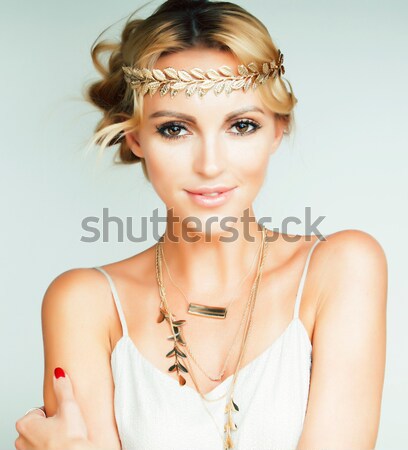 young blond woman dressed like ancient greek godess, gold jewelry close up isolated Stock photo © iordani