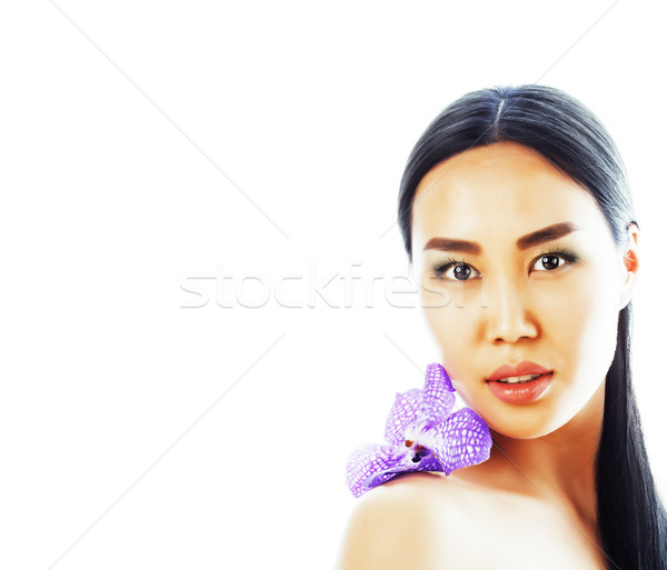 young pretty asian woman with flower orchid close up isolated sp Stock photo © iordani