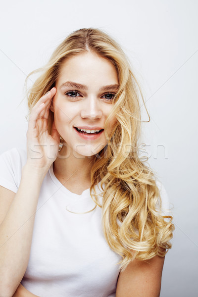 young pretty blond teenage girl emotional posing, happy smiling isolated on white background, lifest Stock photo © iordani