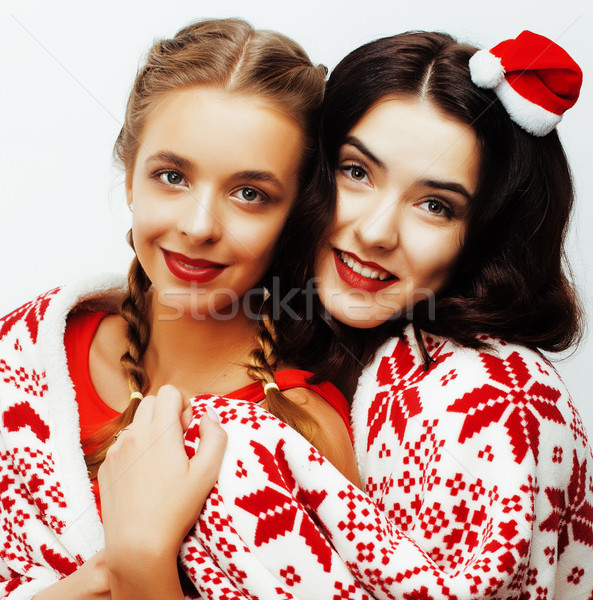 Stock photo: young pretty happy smiling blond and brunette woman girlfriends on christmas in santas red hat and h