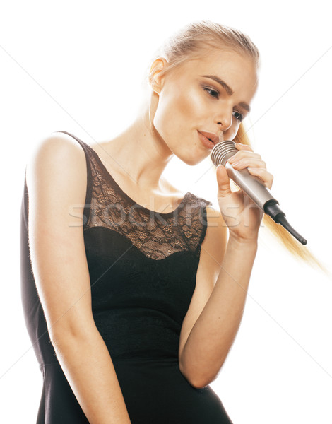 Fiatal csinos szőke nő énekel mikrofon Stock fotó © iordani