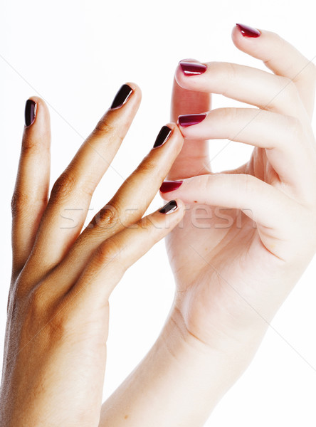 two different nathion manicured hands on white isolated, african Stock photo © iordani