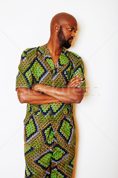 portrait of young handsome african man wearing bright green nati Stock photo © iordani