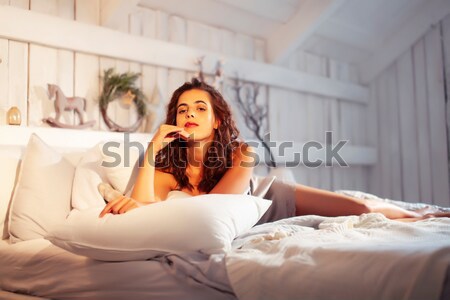 pretty woman playing with goldfish at home, sunlight morning Stock photo © iordani