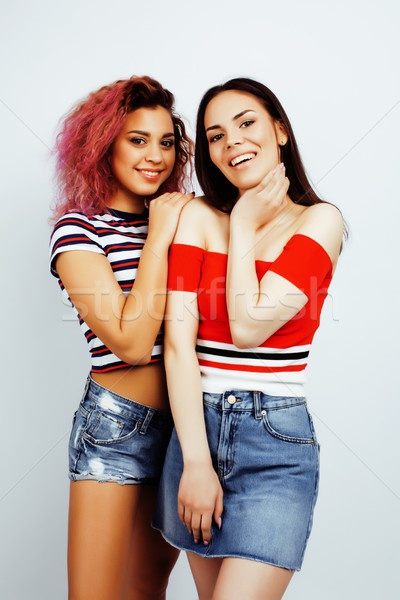 lifestyle people concept: two pretty stylish modern hipster teen girl having fun together, diverse n Stock photo © iordani