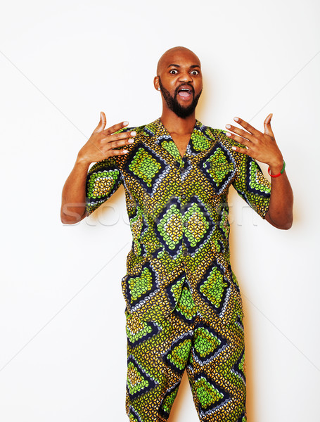 portrait of young handsome african man wearing bright green nati Stock photo © iordani