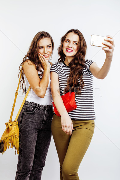 two best friends teenage girls together having fun, posing emotional on white background, besties ha Stock photo © iordani
