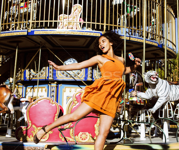 teenage with candy near carousels Stock photo © iordani