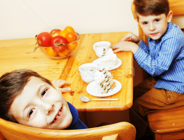 Kicsi aranyos fiúk eszik desszert fából készült Stock fotó © iordani
