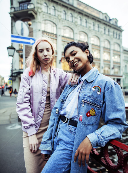 Two teenage girls infront of university building smiling, having Stock photo © iordani