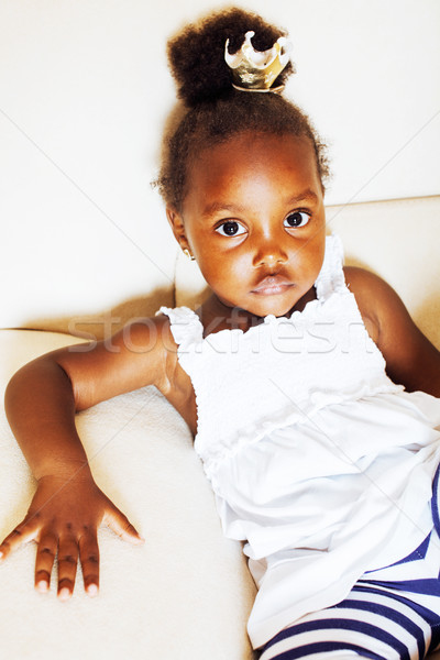 Stock photo: little pretty african american girl sitting in white chair weari