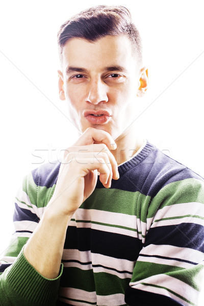 Portrait of a smart serious young man standing against white bac Stock photo © iordani