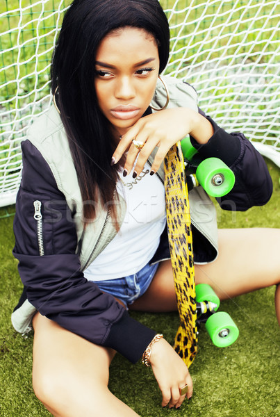 Stock photo: cool pretty smiling afro-american happy young woman with skate b