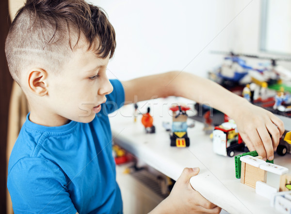 little cute preschooler boy playing toys at home happy smiling, lifestyle children concept Stock photo © iordani