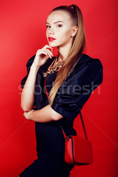 young pretty woman young lady posing on red background, lifestyle people concept Stock photo © iordani