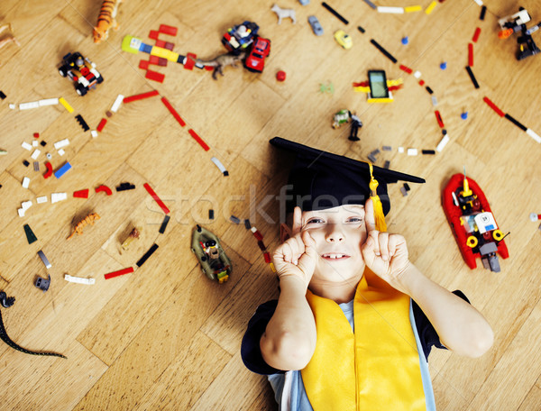 little cute preschooler boy among toys lego at home in graduate  Stock photo © iordani