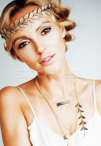 young blond woman dressed like ancient greek godess, gold jewelr Stock photo © iordani