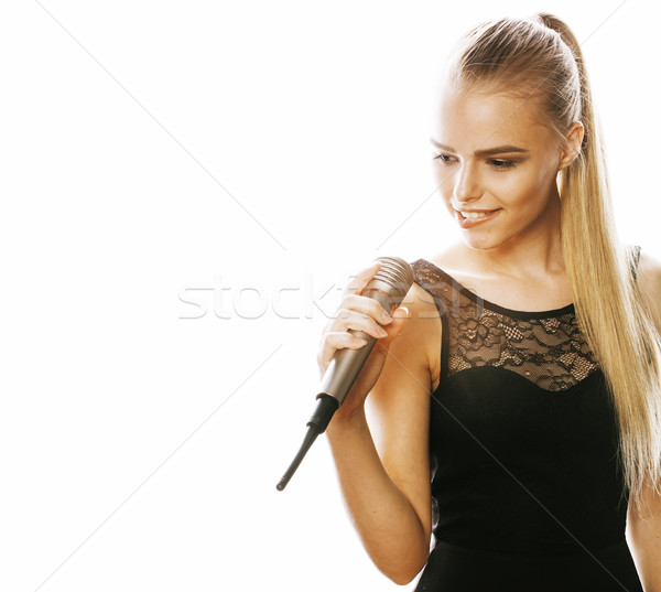 young pretty blond woman singing in microphone isolated close up Stock photo © iordani