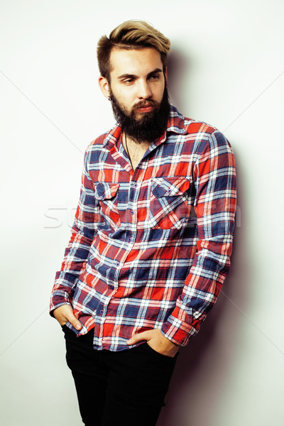 Stock photo: portrait of young bearded hipster guy smiling on white background close up, brutal man, lifestyle pe