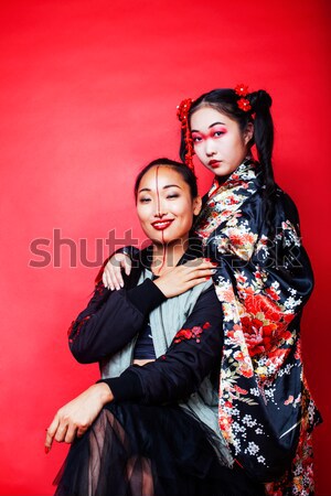 young fashion style couple man and woman on red sexy background, luxury stuff, lifestyle modern peop Stock photo © iordani