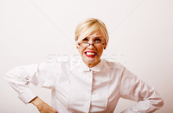 very emotional businesswoman in glasses, blond hair on white bac Stock photo © iordani