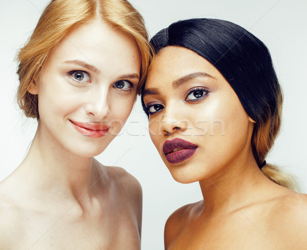 different nation woman: african-american, caucasian together isolated on white background happy smil Stock photo © iordani
