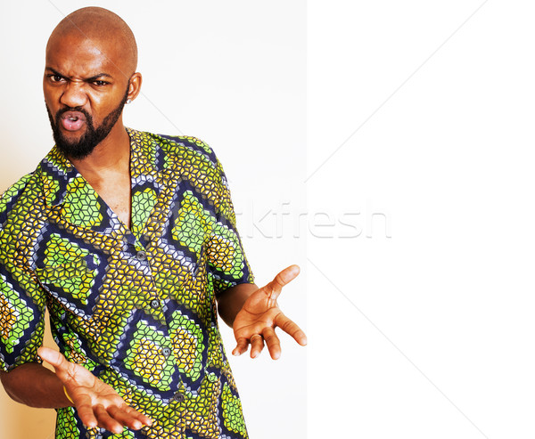 portrait of young handsome african man wearing bright green nati Stock photo © iordani