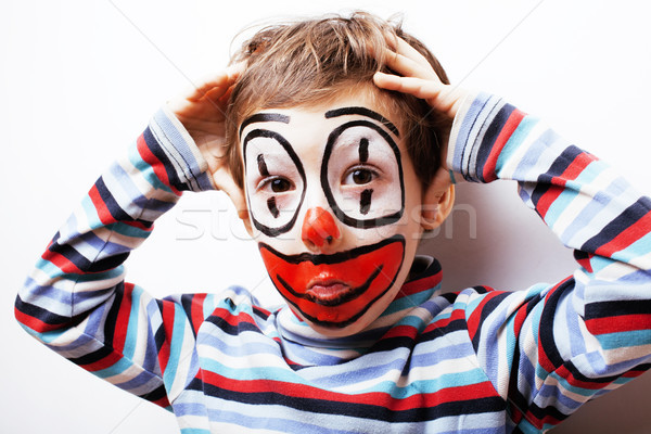 little cute boy with facepaint like clown, pantomimic expression Stock photo © iordani