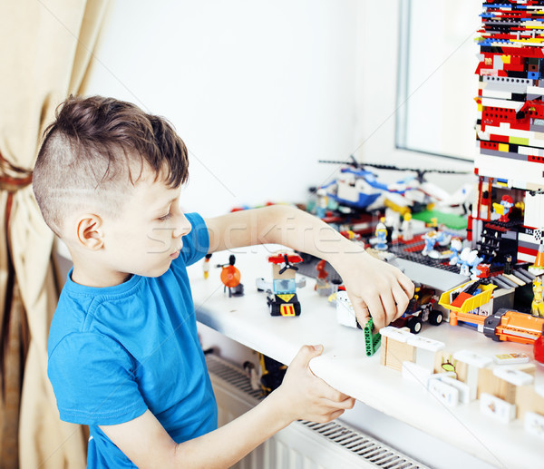 little cute preschooler boy playing lego toys at home happy smil Stock photo © iordani